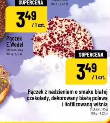 Pączek z nadzieniem o smaku białej czekolady, dekorowany białą polewą i liofilizowaną wiśnią