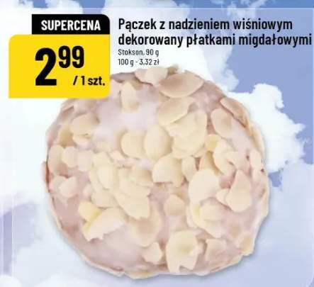 Pączek z nadzieniem wiśniowym dekorowany płatkami migdałowymi